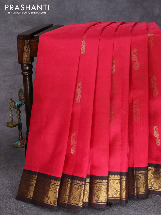 Silk cotton saree tomato red and coffee brown with peacock zari woven buttas and zari woven korvai border