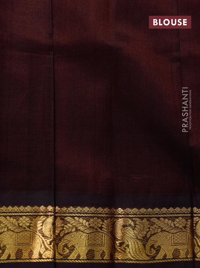 Silk cotton saree tomato red and coffee brown with peacock zari woven buttas and zari woven korvai border