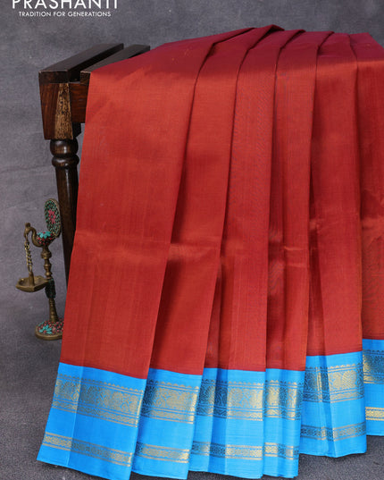 Silk cotton saree rustic brown and cs blue with plain body and rettapet zari woven korvai border
