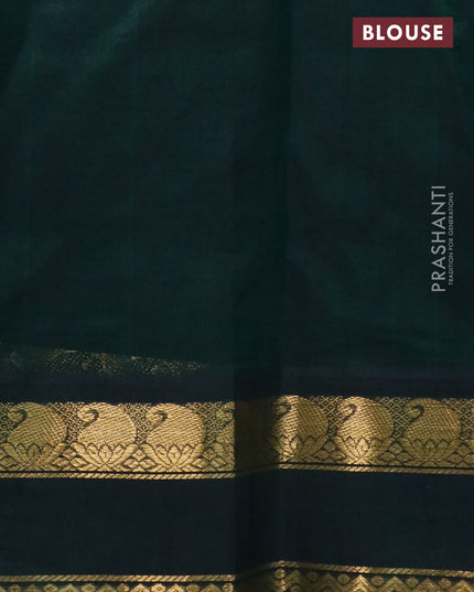 Silk cotton saree magenta pink and dark green with plain body and paisley rettapet zari woven korvai border