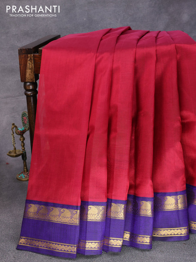 Silk cotton saree maroon and blue with plain body and paisley rettapet zari woven korvai border
