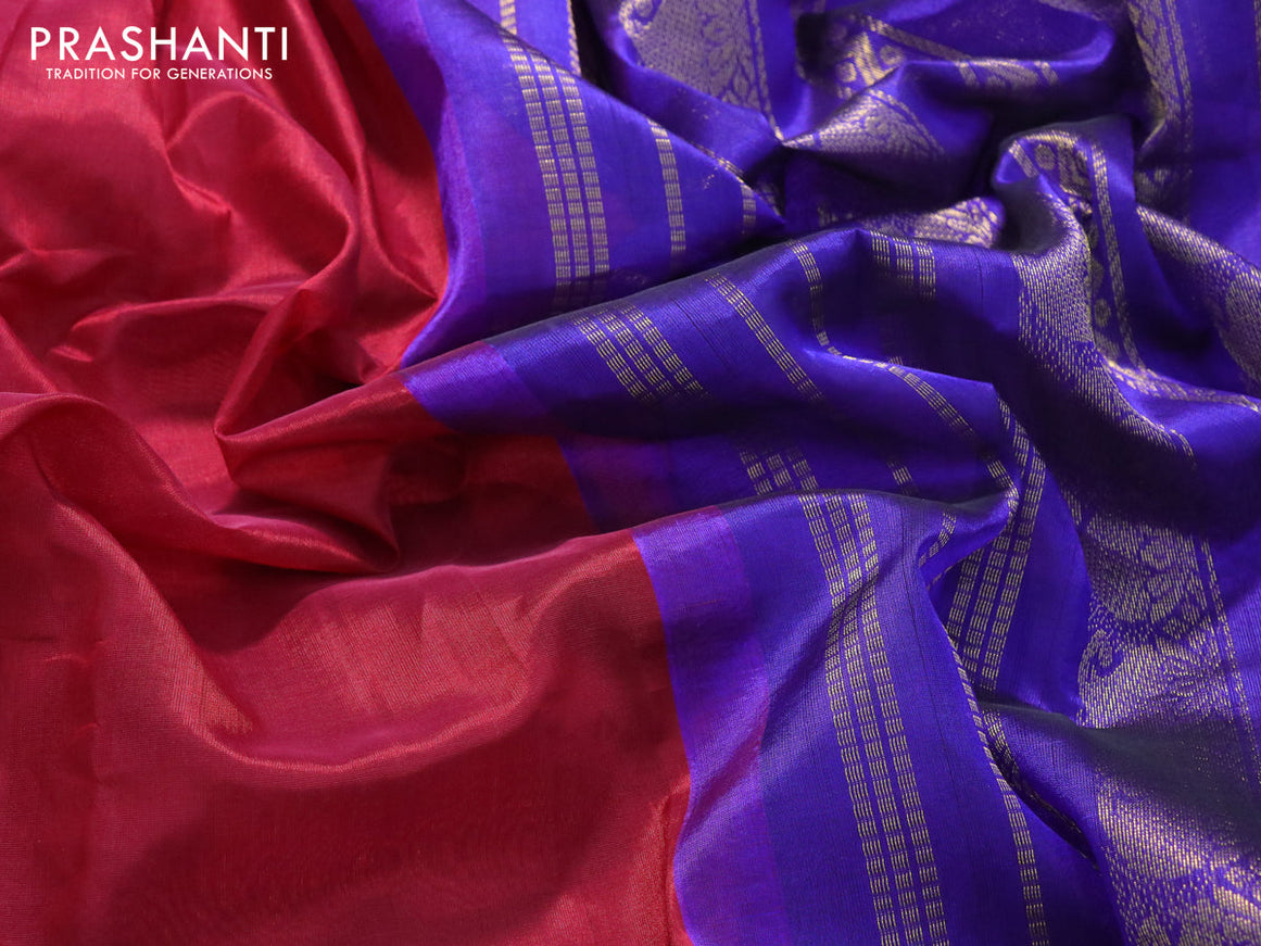 Silk cotton saree maroon and blue with plain body and paisley rettapet zari woven korvai border