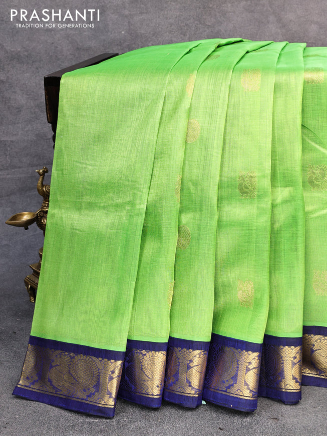 Silk cotton saree light green and blue with annam & rudhraksha zari woven buttas and annam zari woven korvai border