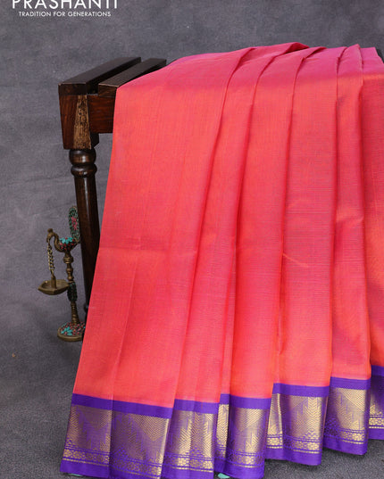 Silk cotton saree dual shade of pinkish orange and blue with allover vairosi pattern and temple design zari woven korvai border