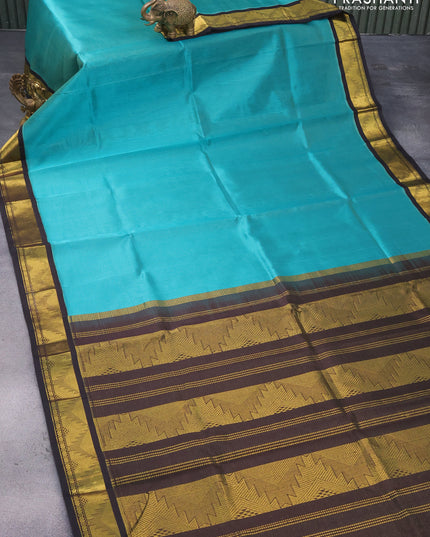 Silk cotton saree teal blue and black with allover vairosi pattern and temple design zari woven korvai border