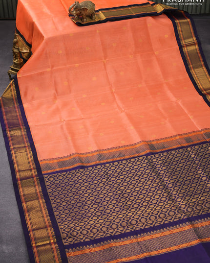 Silk cotton saree peach orange and navy blue with rudhraksha zari woven buttas and zari woven korvai border