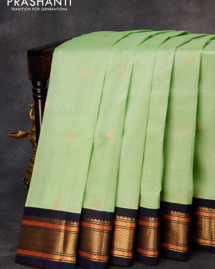 Silk cotton saree pista green and navy blue with rudhraksha zari woven buttas and zari woven korvai border
