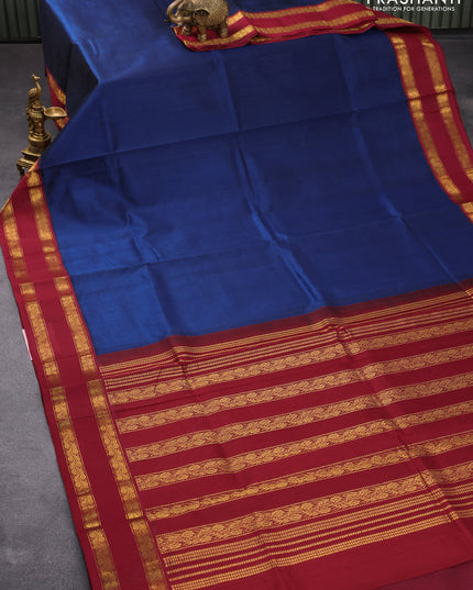 Silk cotton saree peacock blue and maroon with plain body and rettapet zari woven border