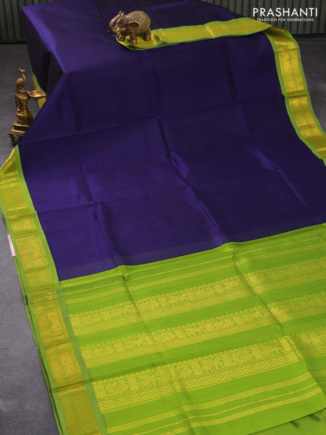 Silk cotton saree navy blue and light green with plain body and zari woven korvai border