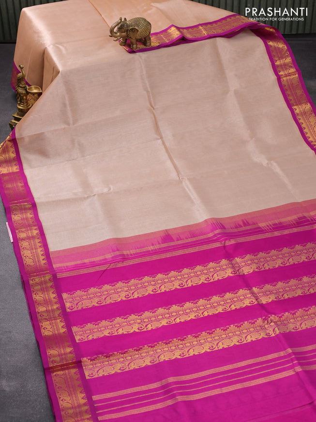 Silk cotton saree pastel peach and purple with plain body and zari woven korvai border