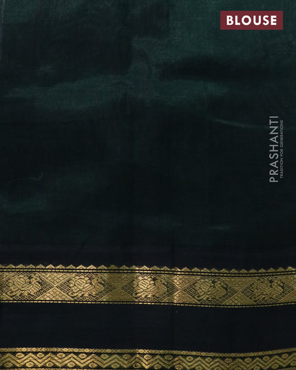 Silk cotton saree peach shade and bottle green with plain body and rettapet zari woven korvai border