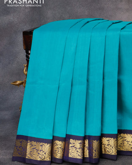 Silk cotton saree teal blue and blue with plain body and zari woven korvai border