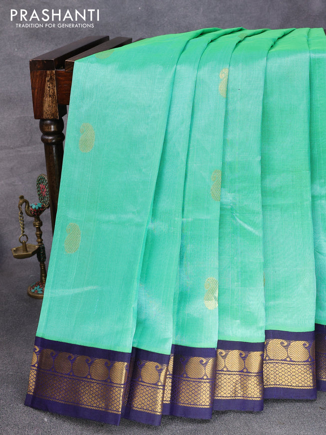 Silk cotton saree teal green and blue with paisley zari woven buttas and zari woven korvai border