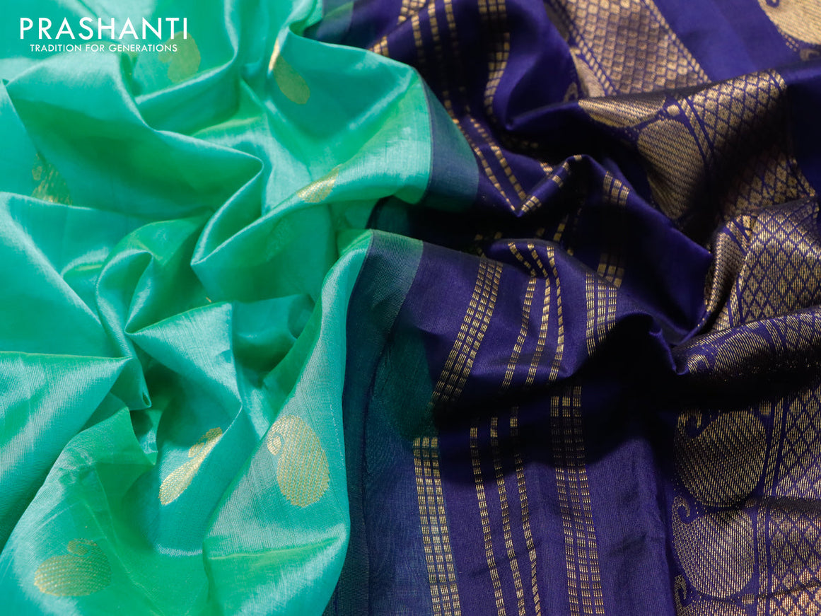 Silk cotton saree teal green and blue with paisley zari woven buttas and zari woven korvai border