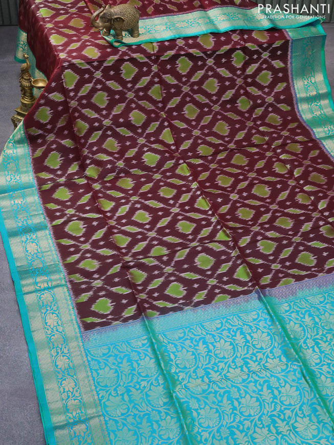 Ikat soft silk saree deep maroon and dual shade of teal blue with allover ikat weaves and zari woven floral border