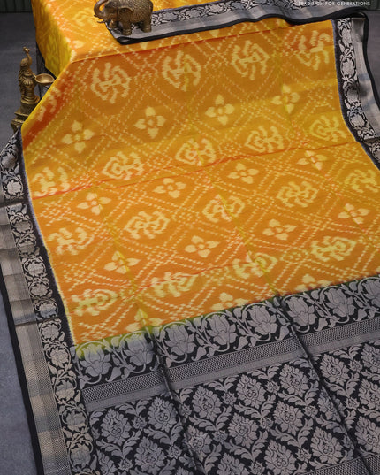 Ikat soft silk saree dual shade mustard yellow and black with allover ikat weaves and floral silver zari woven border