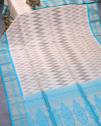 Ikat soft silk saree beige grey and cs blue with allover ikat weaves and peacock zari woven border