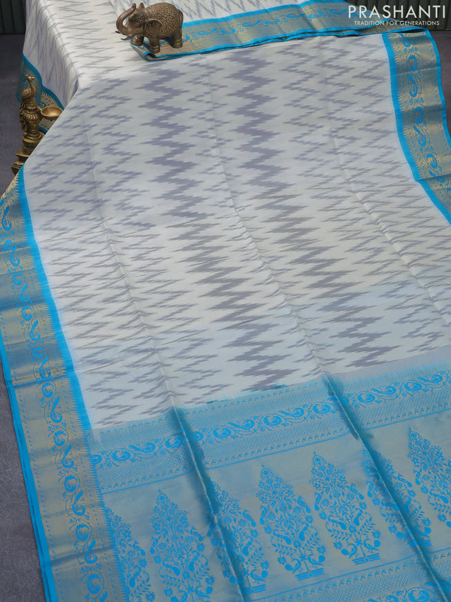 Ikat soft silk saree off white grey and cs blue with allover ikat weaves and peacock zari woven border