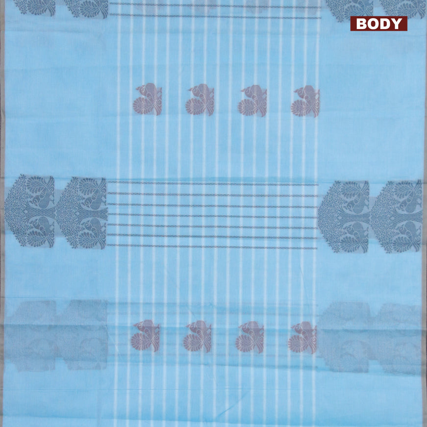 Nithyam cotton saree light blue and chikku shade with allover thread weaves & buttas and piping border