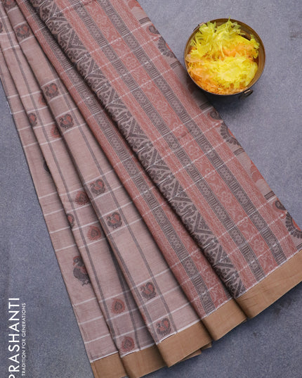 Nithyam cotton saree pastel brown and chikku shade with allover thread weaves & buttas and simple border