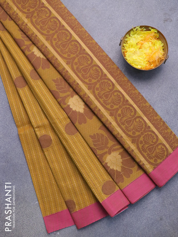 Nithyam cotton saree mustard yellow and pink with allover zari weaves & buttas and simple border