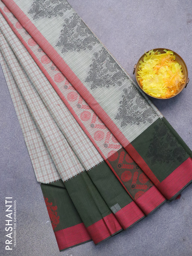 Nithyam cotton saree elaichi green and dark green with allover checked pattern and thread woven butta border