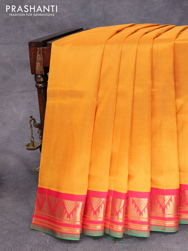 Silk cotton saree dark mustard and red with plain body and temple design zari woven korvai border