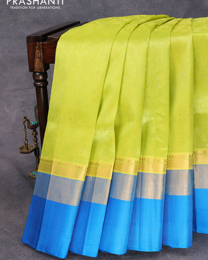 Kuppadam silk cotton saree lime yellow and cs blue with allover self emboss jaquard and long zari woven simple border