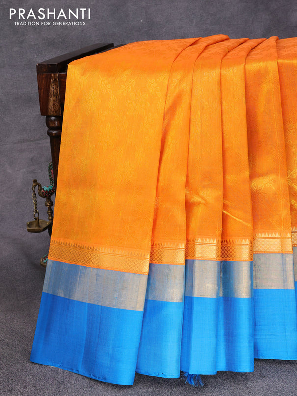 Kuppadam silk cotton saree dual shade of mango yellow and cs blue with allover self emboss jaquard and long zari woven simple border