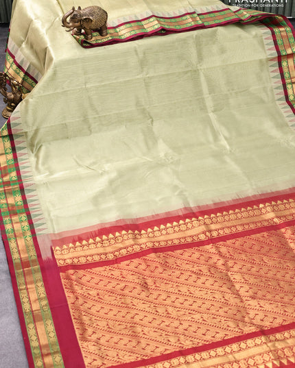 Silk cotton saree elaichi green and maroon with allover vairosi pattern and temple design zari woven korvai border