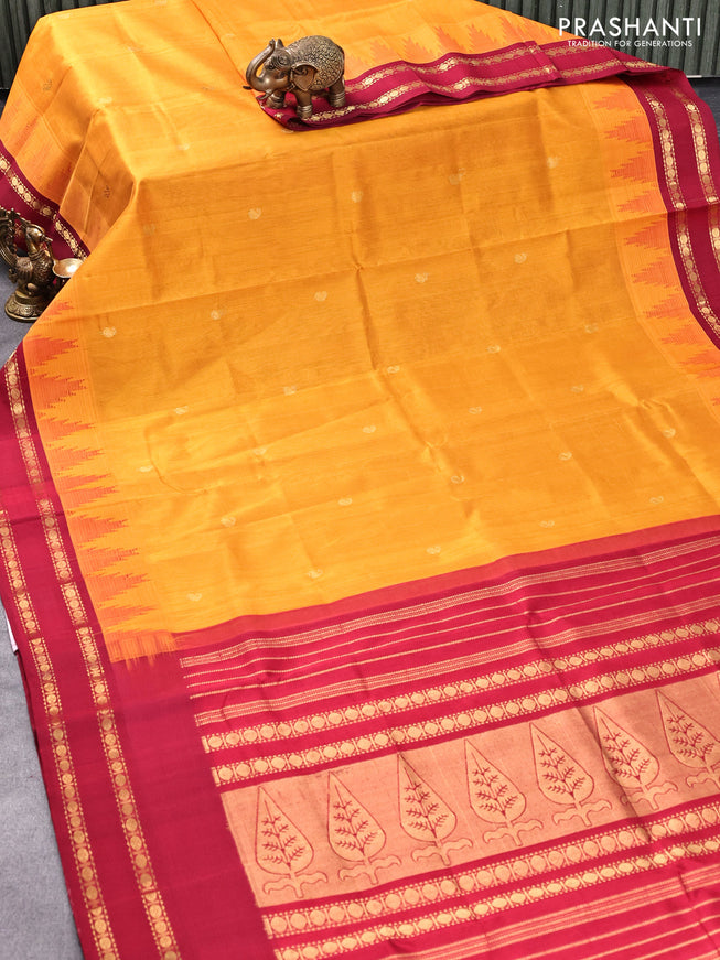 Silk cotton saree mango yellow and maroon with paisley zari woven buttas and temple design rettapet zari woven korvai border