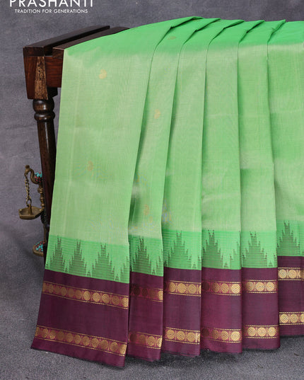 Silk cotton saree green and wine shade with paisley zari woven buttas and temple design rettapet zari woven korvai border