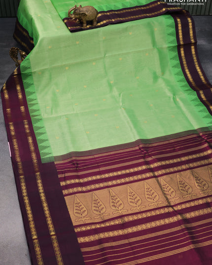 Silk cotton saree green and wine shade with paisley zari woven buttas and temple design rettapet zari woven korvai border