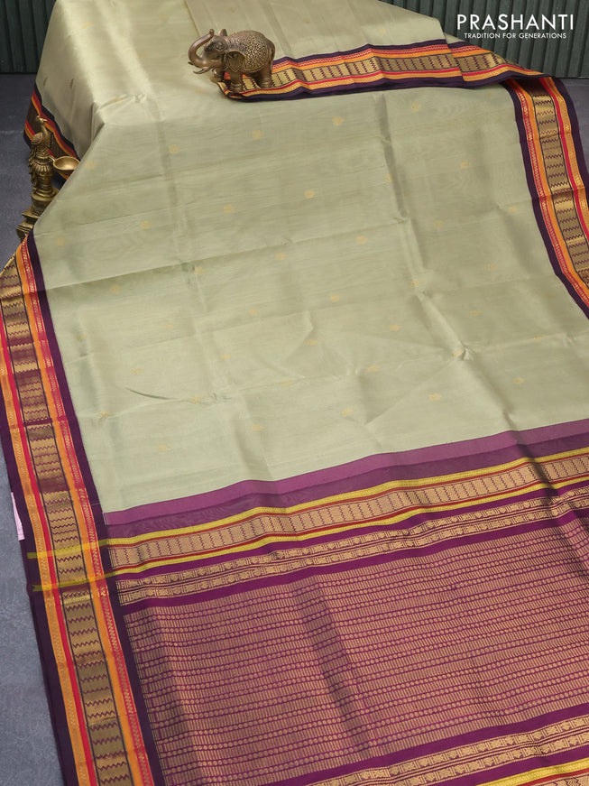 Silk cotton saree elaichi green and purple with zari woven buttas and zari woven korvai border