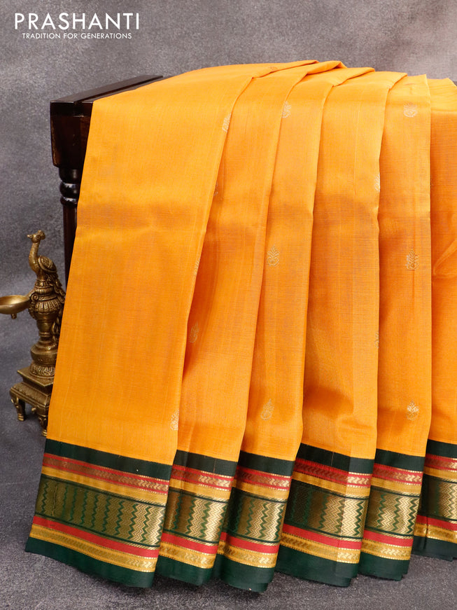 Silk cotton saree mustard yellow and green with zari woven buttas and zari woven korvai border