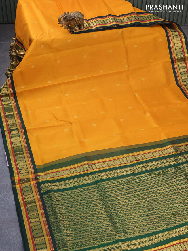 Silk cotton saree mustard yellow and green with zari woven buttas and zari woven korvai border