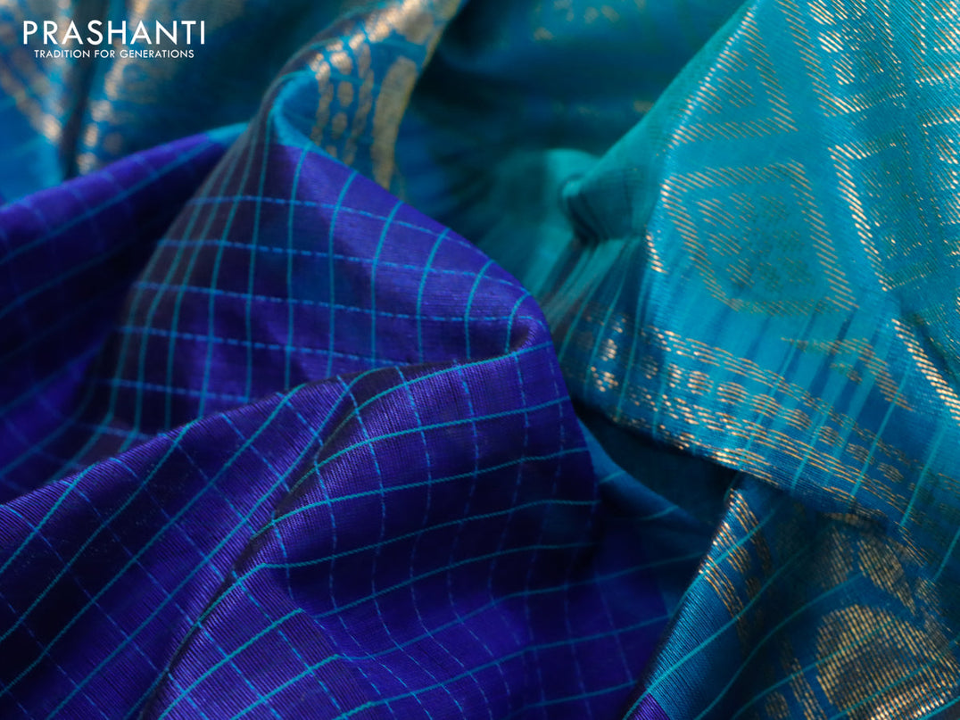 Kuppadam silk cotton saree blue shade and dual shade of teal blue with allover thread check pattern and temple design zari woven annam border