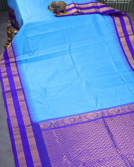 Kuppadam silk cotton saree blue shade and royal blue with plain body and long temple design zari woven border