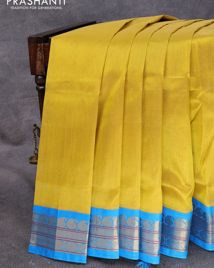 Kuppadam silk cotton saree mustard shade and cs blue with plain body and zari woven korvai border