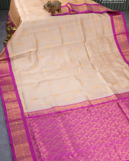 Silk cotton saree sandal and purple with zari woven buttas and zari woven korvai border