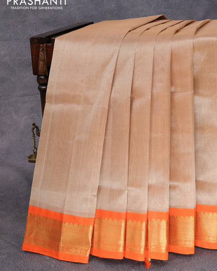 Silk cotton saree beige and orange with plain body and zari woven korvai border