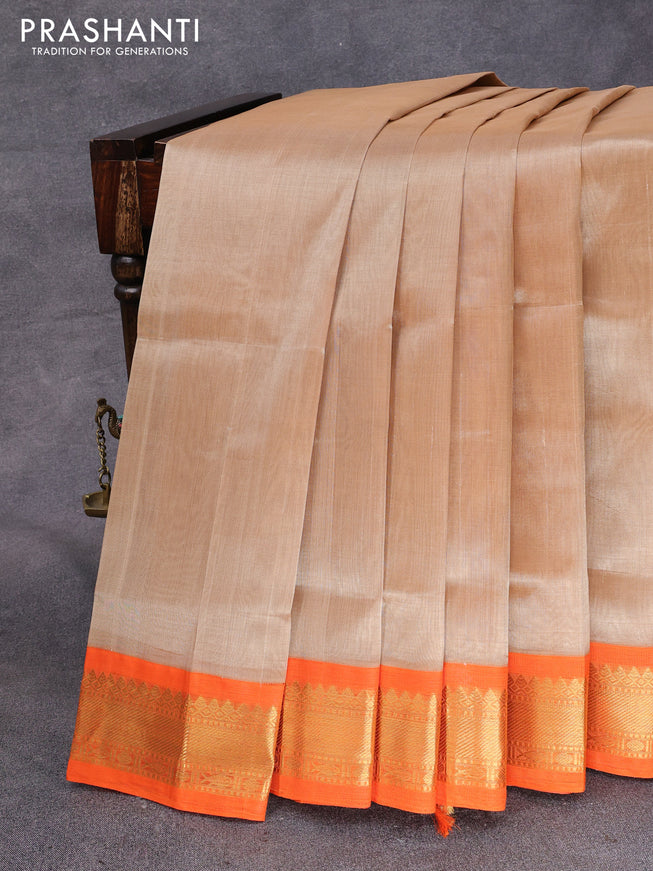 Silk cotton saree beige and orange with plain body and zari woven korvai border
