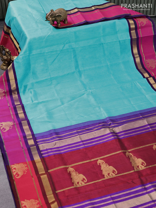 Silk cotton saree teal blue and violet with plain body and zari woven butta korvai border