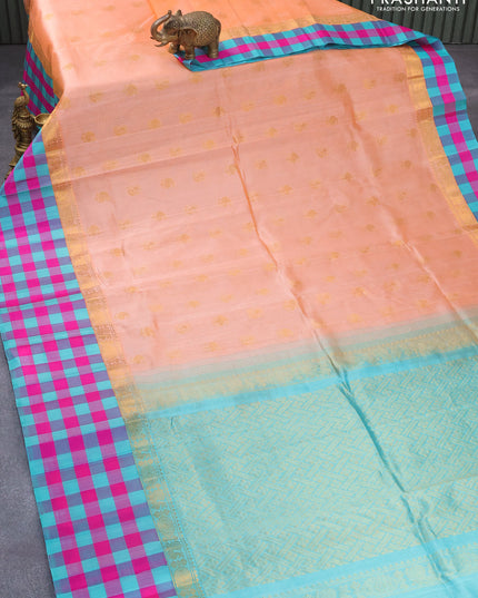 Kuppadam silk cotton saree peach orange and teal blue with annam & paisley zari woven buttas and long zari woven checked border