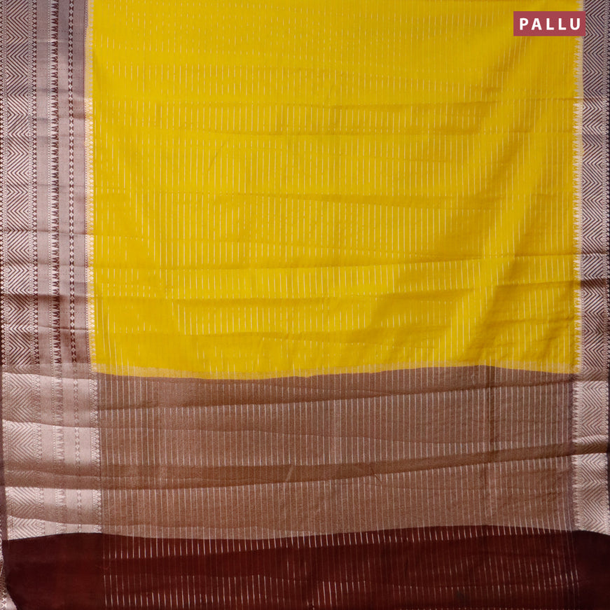 Semi dupion saree yellow and coffee brown with allover zari stripes pattern and long zari woven border & meenakari blouse
