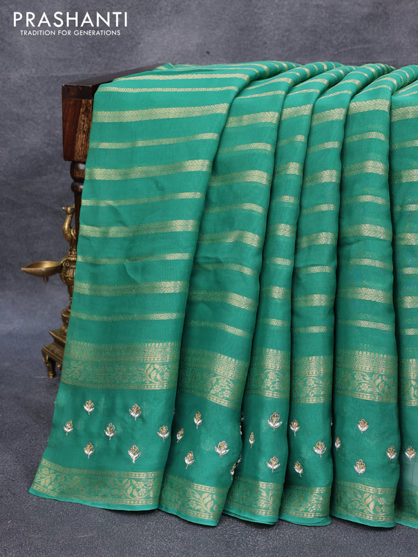 Organza silk saree teal green with allover zari stripes pattern and embroidery work butta border & embroidery work readymade blouse