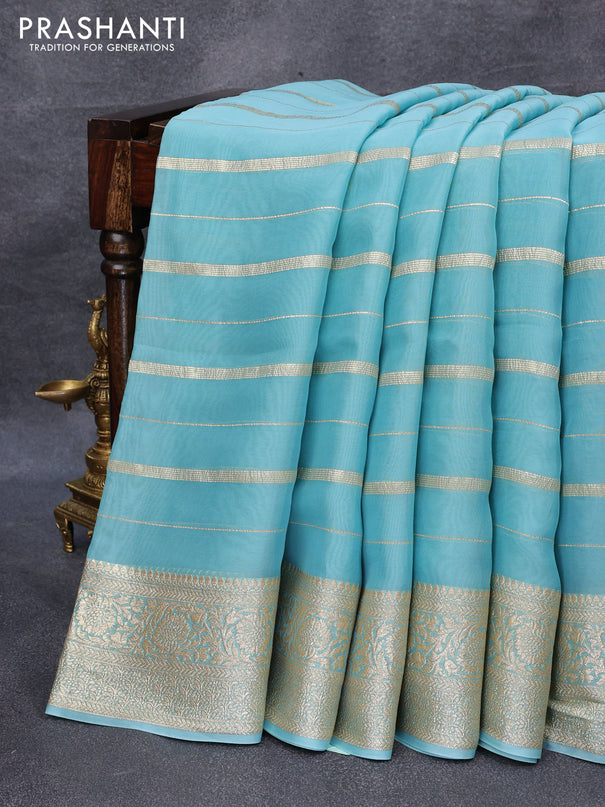 Organza silk saree light blue with allover zari woven stripes pattern and zari woven border & embroidery work readymade blouse
