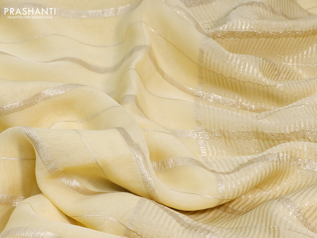 Organza silk saree pale yellow with allover zari woven stripes pattern and zari woven border & embroidery work readymade blouse