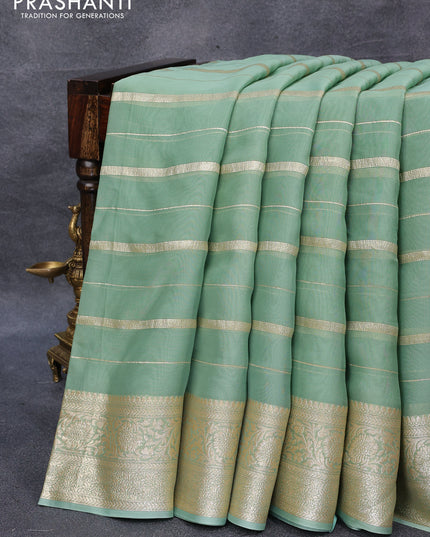 Organza silk saree pastel green with allover zari woven stripes pattern and zari woven border & embroidery work readymade blouse