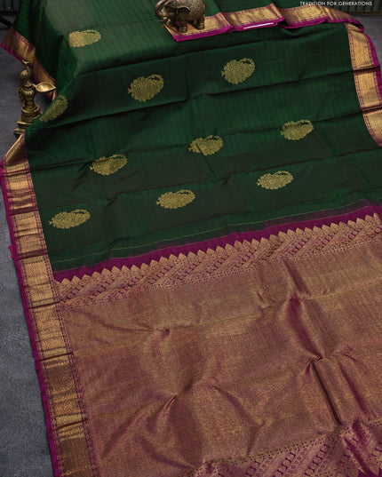 Pure kanjivaram silk saree dual shade of dark green and magenta pink with zari woven paisley buttas and zari woven border & butta style